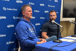Rams general manager Les Snead, left, and coach Sean McVay speak to reporters.