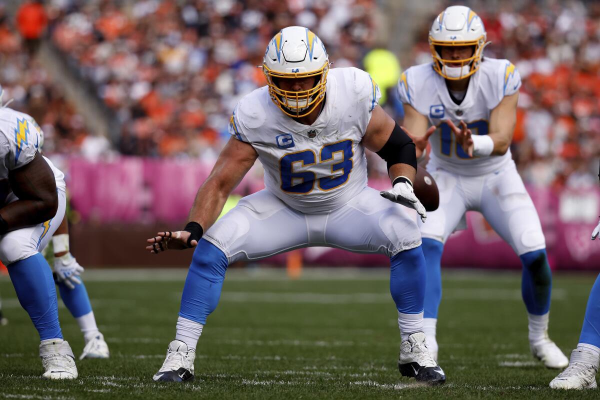  Chargers center Corey Linsley (63) looks to make a block in front of quarterback Justin Herbert.