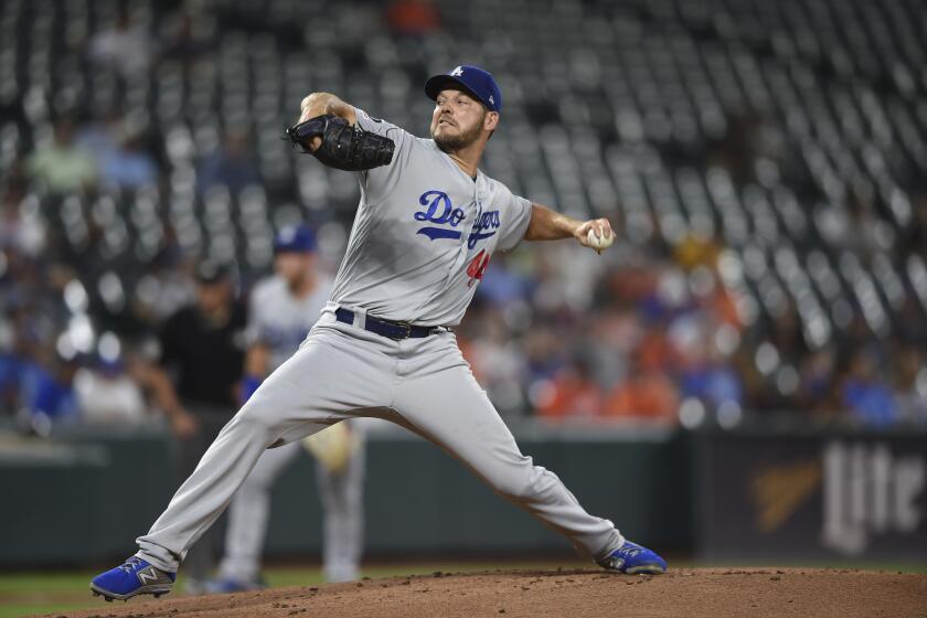 Los Angeles Dodgers pitcher Rich Hill throws against the Baltimore Orioles in the first inning of a baseball game, Thursday, Sept. 12, 2019, in Baltimore. (AP Photo/Gail Burton)