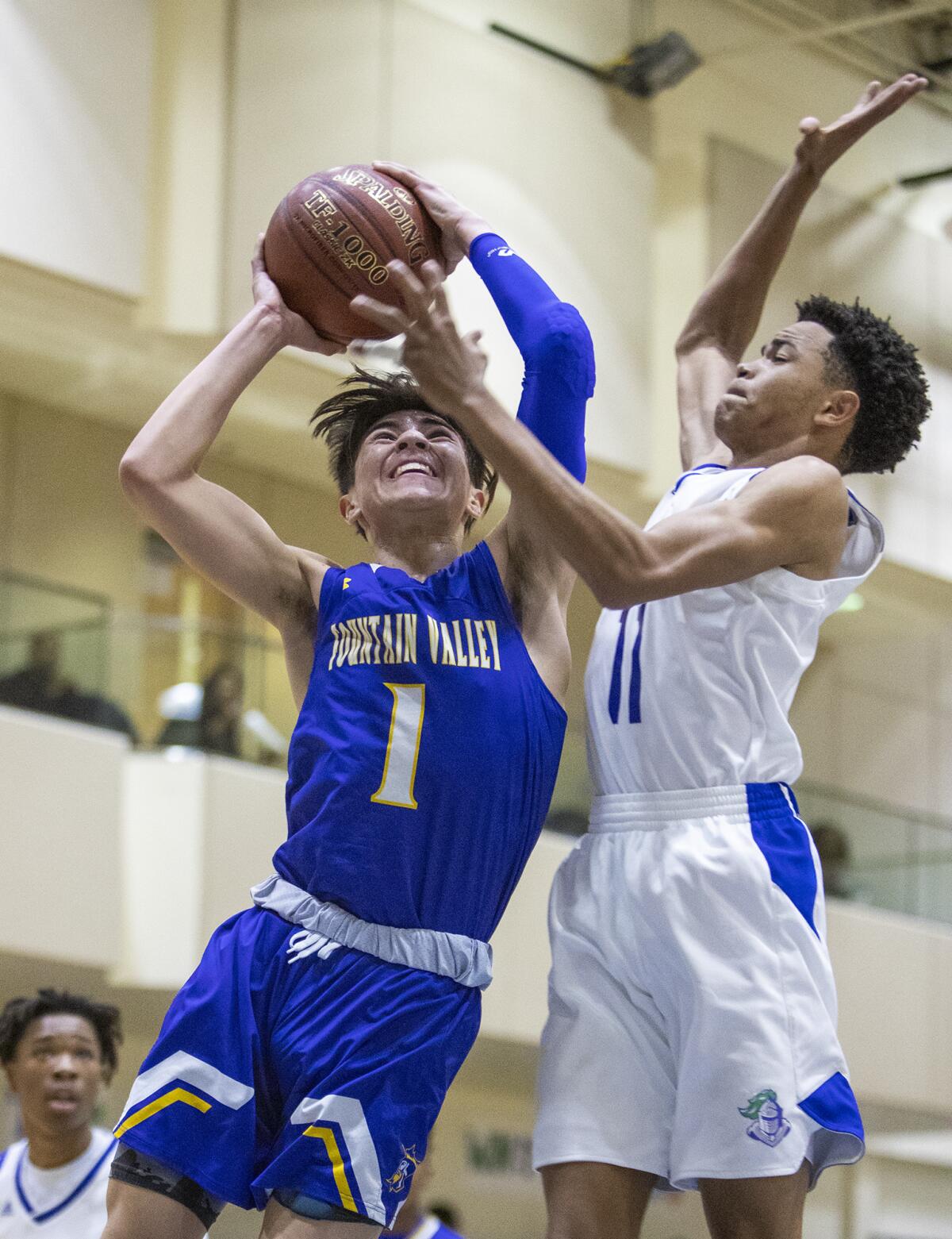 Fountain Valley's Aden Casarez goes up for a shot against Price's Christian Williams during the quarterfinals of the CIF State Southern California Regional Division III playoffs on Thursday.