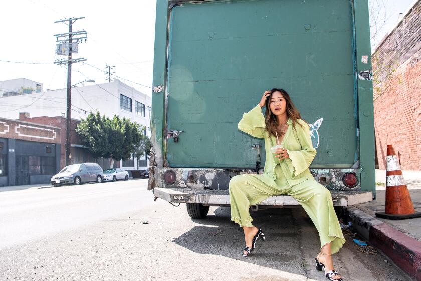 LOS ANGELES, CA - APRIL 16: Portrait of Aimee Song in the Arts District on Friday, April 16, 2021 in Los Angeles, CA. In this look: Set: Song Of Style Shoes: Song Of Style (Mariah Tauger / Los Angeles Times)