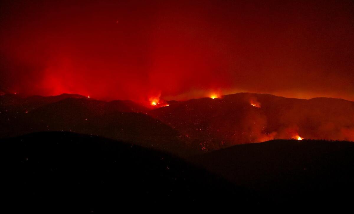 The Hill fire burns near Huer Huero Road in Santa Margarita on Monday. (Joe Johnston / AP)