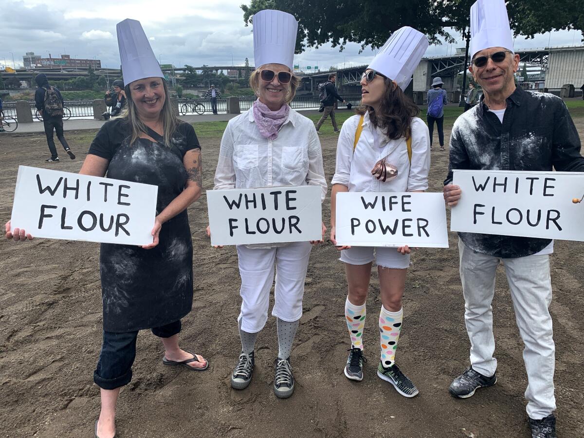 Portlanders display flour power Saturday, aiming to defuse hate and potential violence with humor