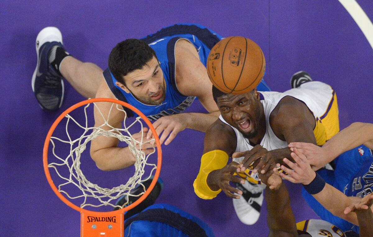 Dallas Mavericks center Zaza Pachulia and Los Angeles Lakers center Roy Hibbert battle for a rebound during a Nov. 1 game at Staples Center.