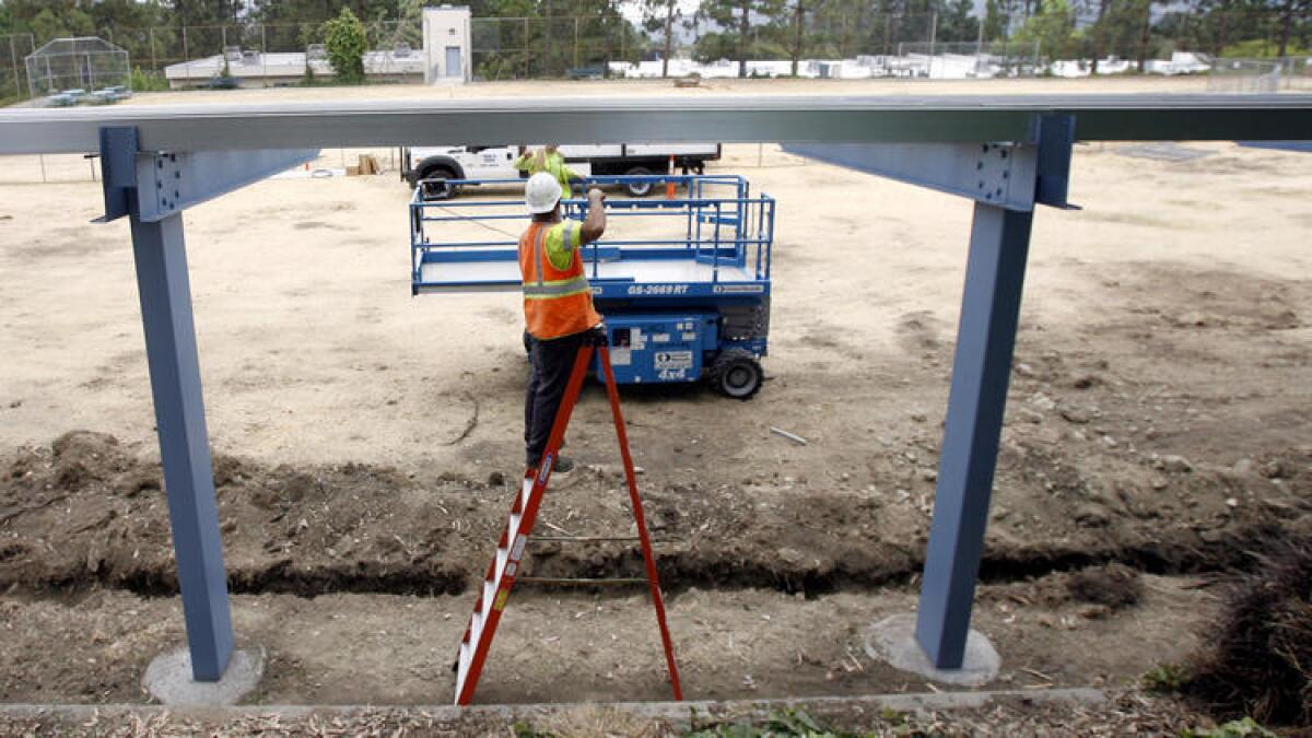 Since the first issuance of bonds, crews have installed solar panels at more than half of the district's 30 schools.