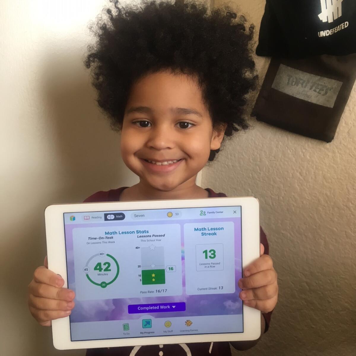 Seven Norwood, 5, of Las Vegas completes schoolwork online.