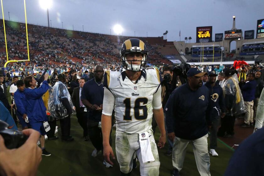 Rams quarterback Jared Goff leaves the field after a 14-10 defeat to the Dolphins in his first start as a pro.