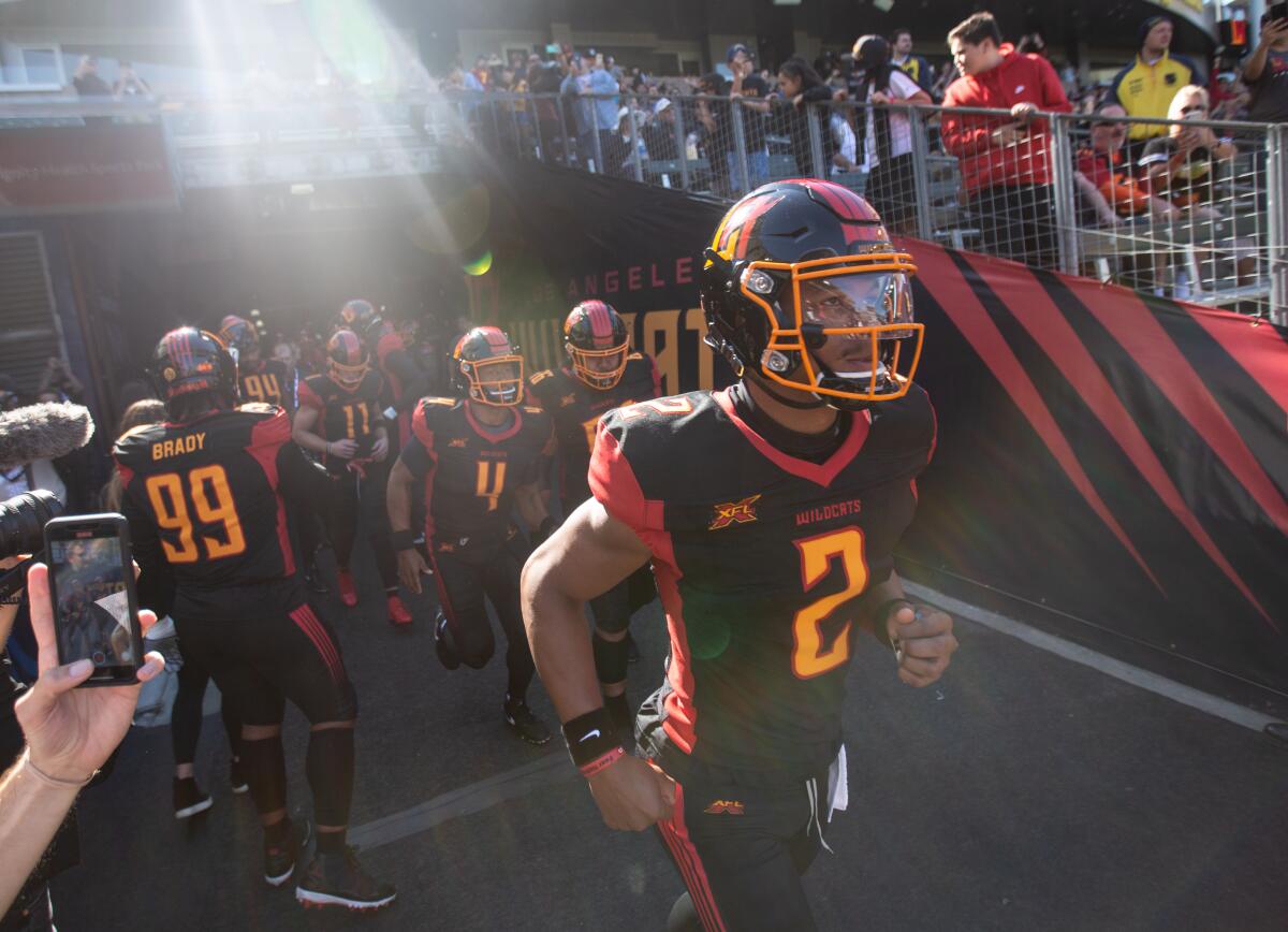 Los Angeles Wildcats quarterback Jalan McClendon runs onto the field before the team's home debut on Sunday.