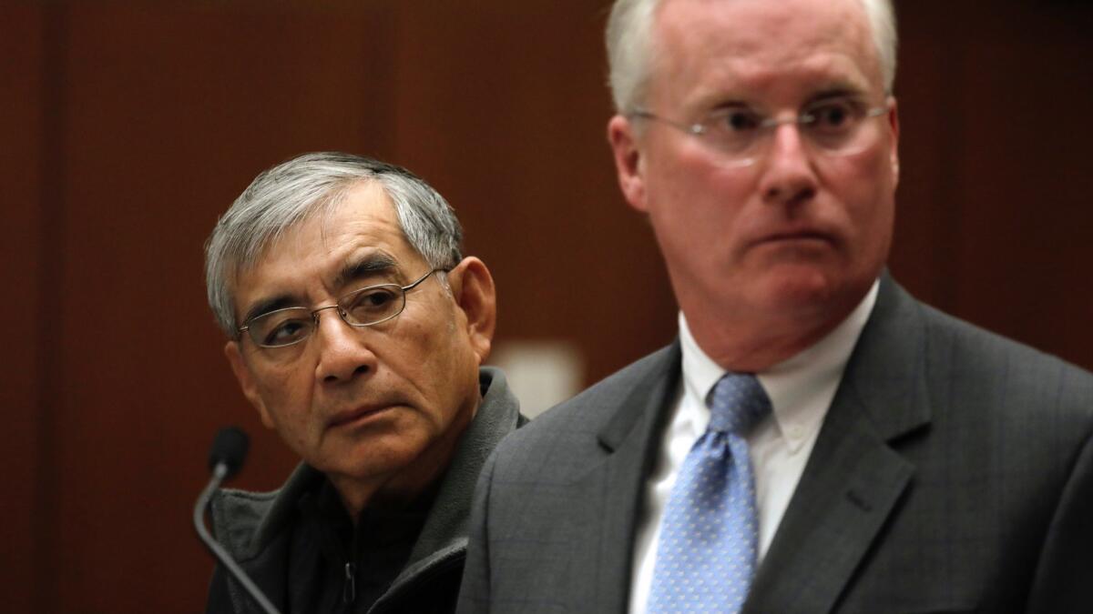 Samuel Leung, left, with his lawyer, Daniel V. Nixon, in Los Angeles Superior Court on Friday. Leung was charged with making illegal campaign donations in connection with an apartment project he was seeking to develop.