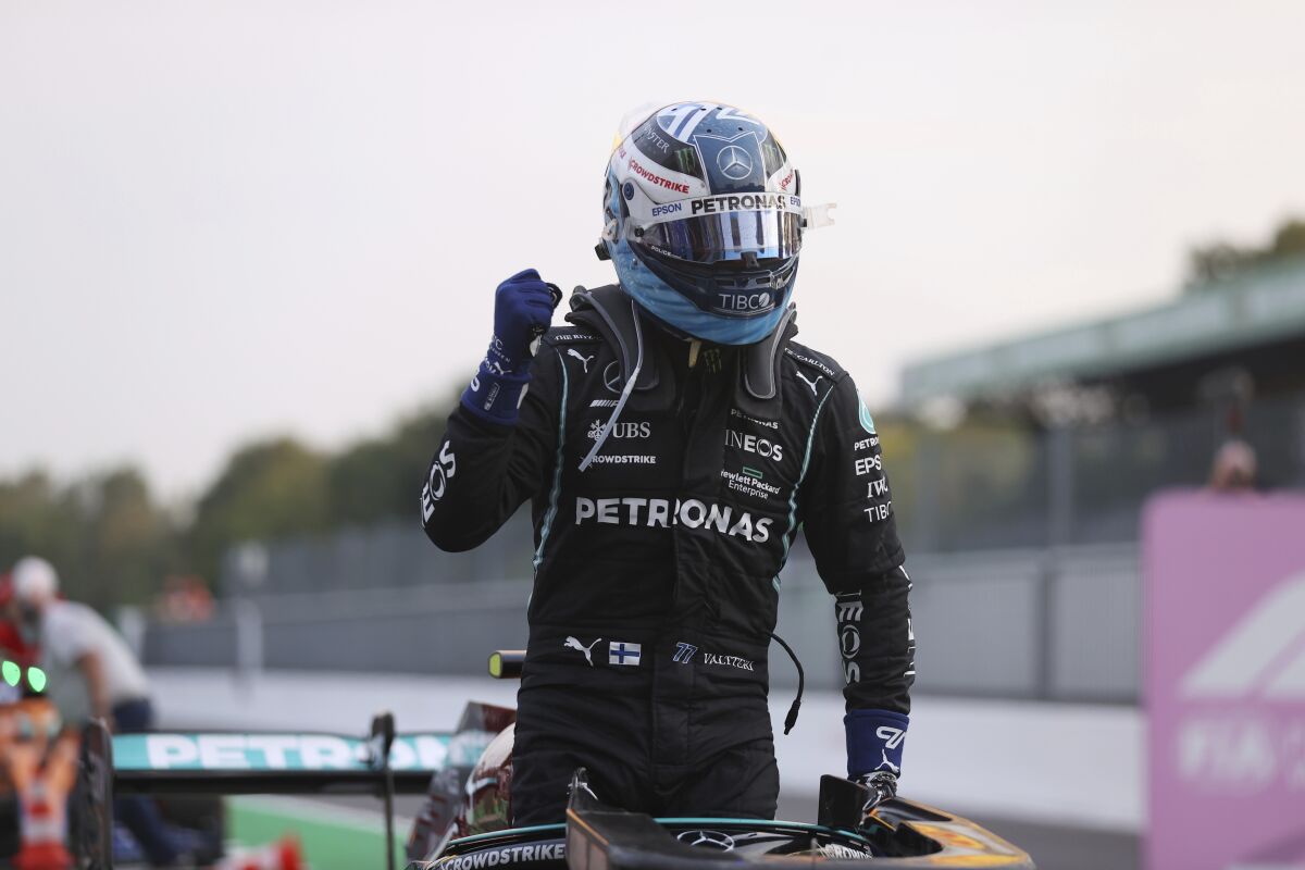 Mercedes driver Valtteri Bottas of Finland reacts after he clocked the fastest time during the qualifying session at the Monza racetrack, in Monza, Italy , Friday, Sept.10, 2021. The Formula one race will be held on Sunday. (Lars Baron/Pool photo via AP)