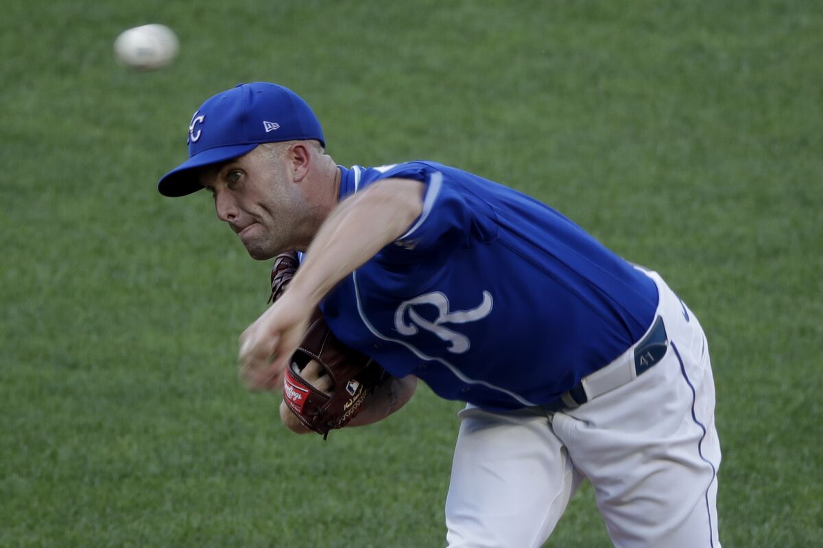 Kansas City Royals pitcher Danny Duffy throws during an intrasquad baseball game at Kauffman Stadium on Wednesday, July 8, 2020, in Kansas City, Mo. (AP Photo/Charlie Riedel)
