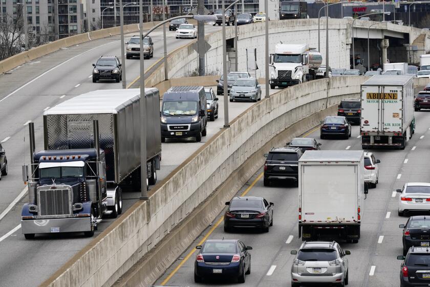 FILE - Motor vehicle traffic moves along the Interstate 76 highway in Philadelphia, March 31, 2021. The government’s traffic safety agency said Thursday, June 22, 2023, that it will require heavy trucks and buses to include potentially life-saving automatic emergency braking equipment within five years. Automatic braking systems in heavy vehicles would prevent nearly 20,000 crashes a year and save at least 155 lives, the National Highway Traffic Safety Administration said. (AP Photo/Matt Rourke, File)