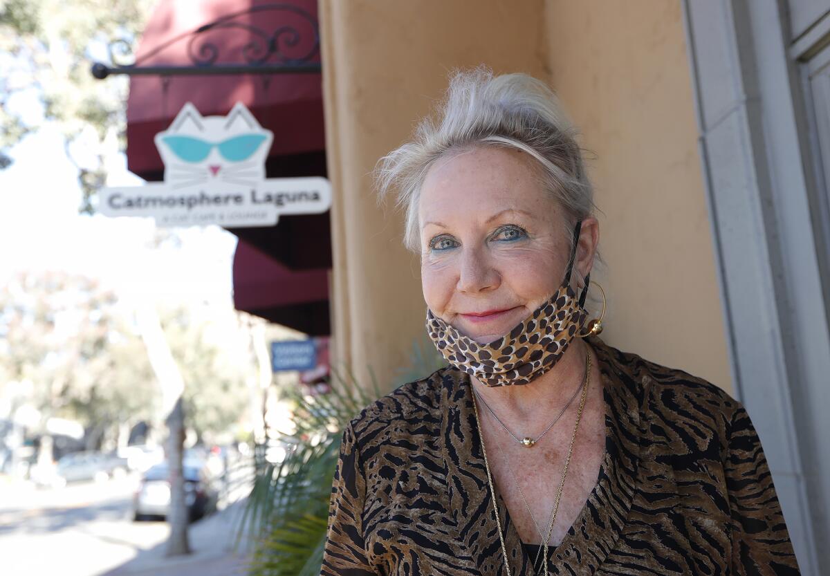 Owner Gail Landau stands in front of Catmosphere, the cat cafe that had to close its doors recently.