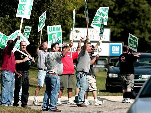 Auto workers picket outside General Motors' truck assembly plant in Pontiac, Mich. The strike by the United Auto Workers union, which represents 73,000 GM employees at 82 U.S. facilities, was the first major work stoppage to hit the industry in nine years.