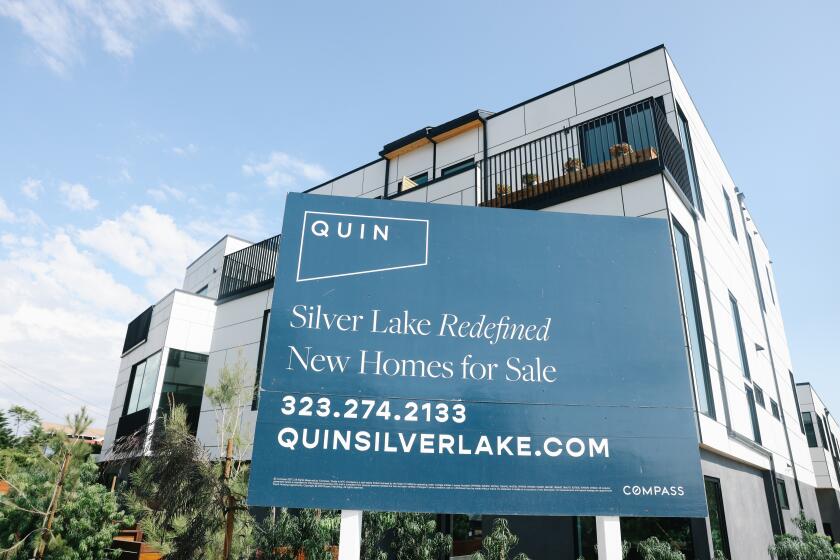 Los Angeles, CA - October 11: A complex of homes on Benton Way is seen for sale in Silverlake on Tuesday, Oct. 11, 2022 in Los Angeles, CA. (Dania Maxwell / Los Angeles Times)