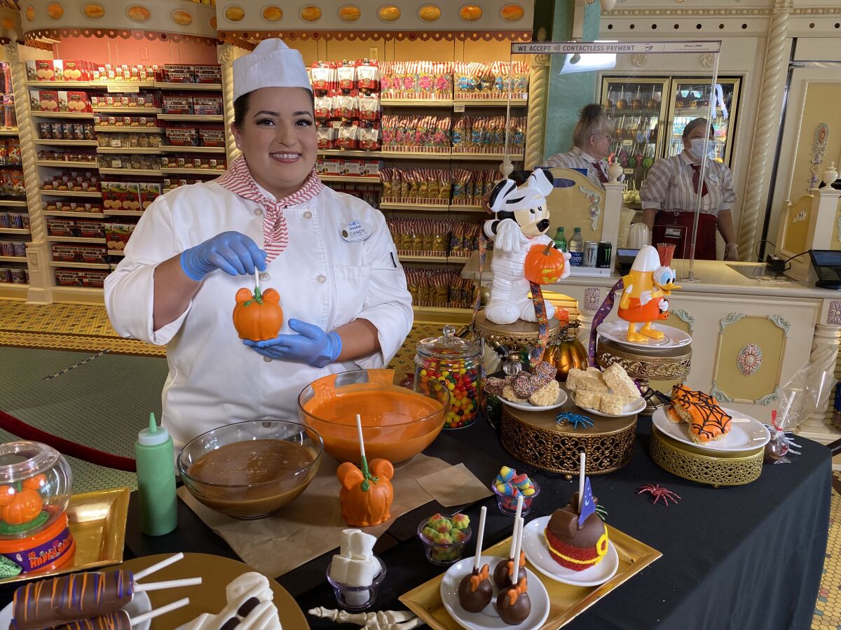 Candy maker Candy Pruitt works on spooky treats at Disneyland Park on Sept. 2, 2022.