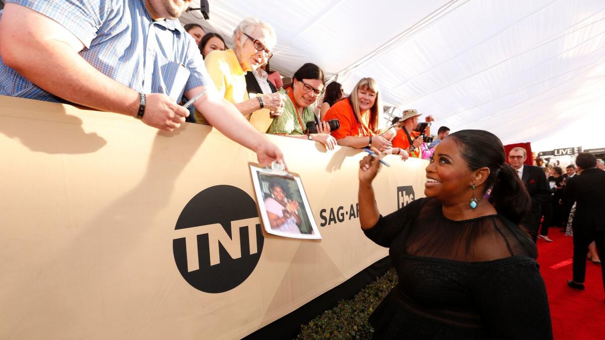 Academy Award winner Octavia Spencer, who's nominated for an Oscar this year for "Hidden Figures," chats with fans during the red carpet arrivals at the Screen Actors Guild Awards on Jan. 29.