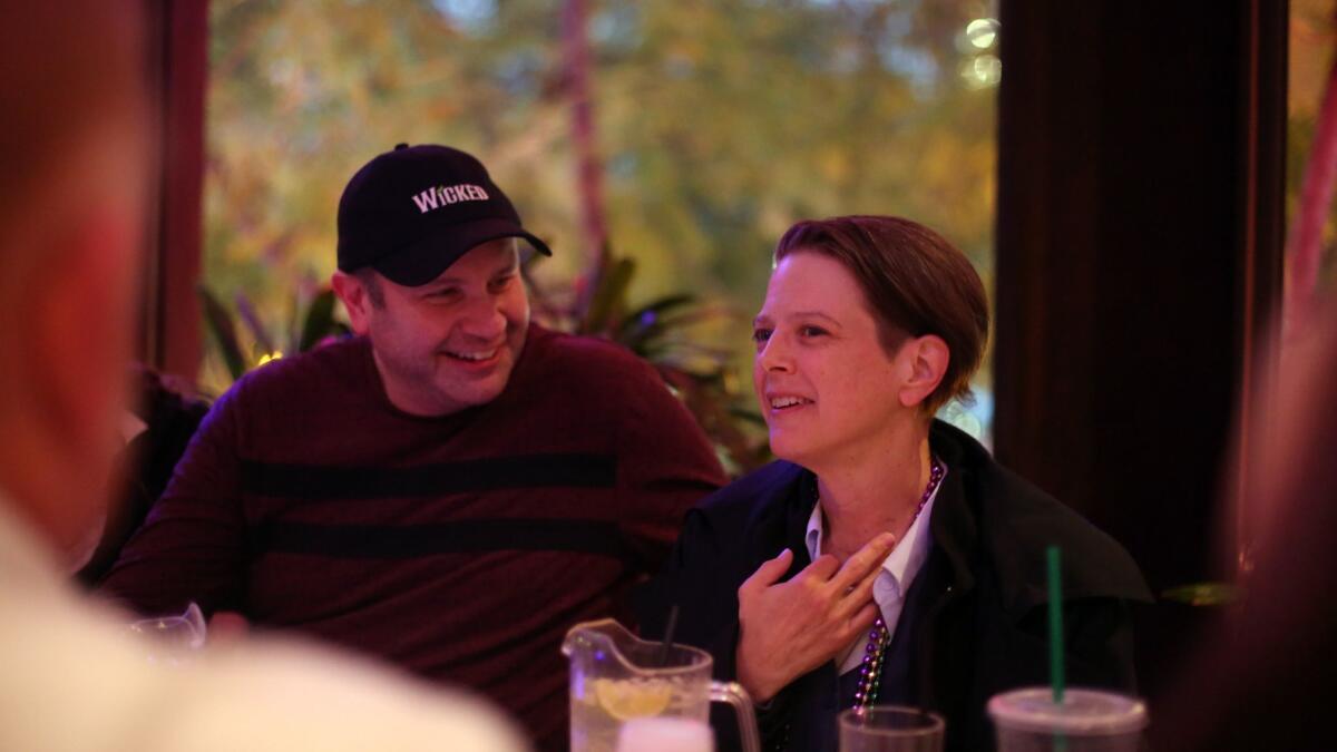 Tim Baudler, left, listens to April Anderson, right, speak during Spirit Pub, a ministry of Hollywood United Methodist Church that meets at a West Hollywood gay bar named Micky's.