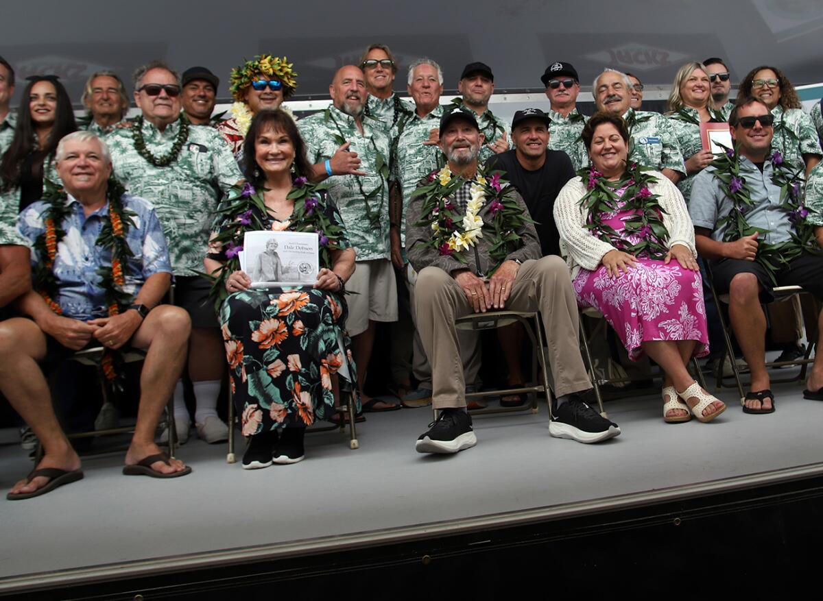 Surfing Walk of Fame inductees pose for pictures with local dignitaries.