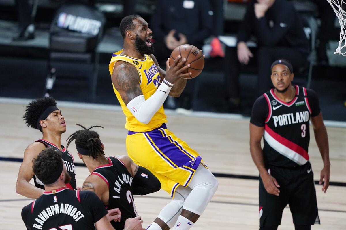 The Lakers' LeBron James scores against the Portland Trail Blazers on Aug. 29, 2020.