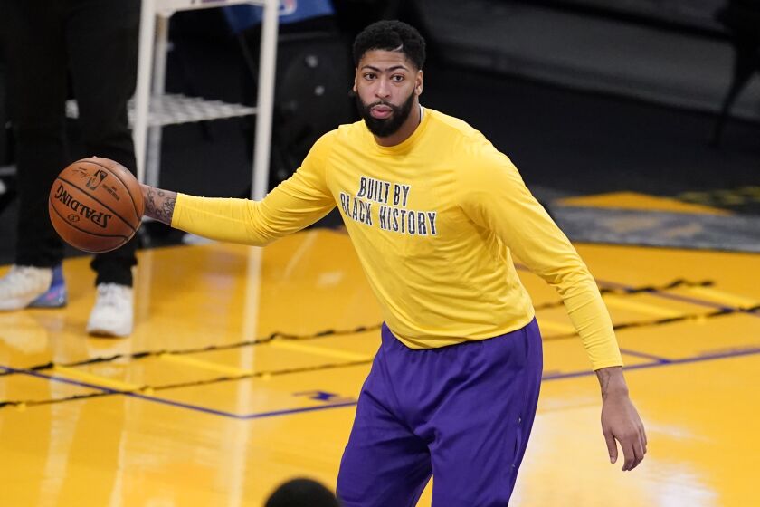 Los Angeles Lakers forward Anthony Davis warms up before an NBA basketball game.