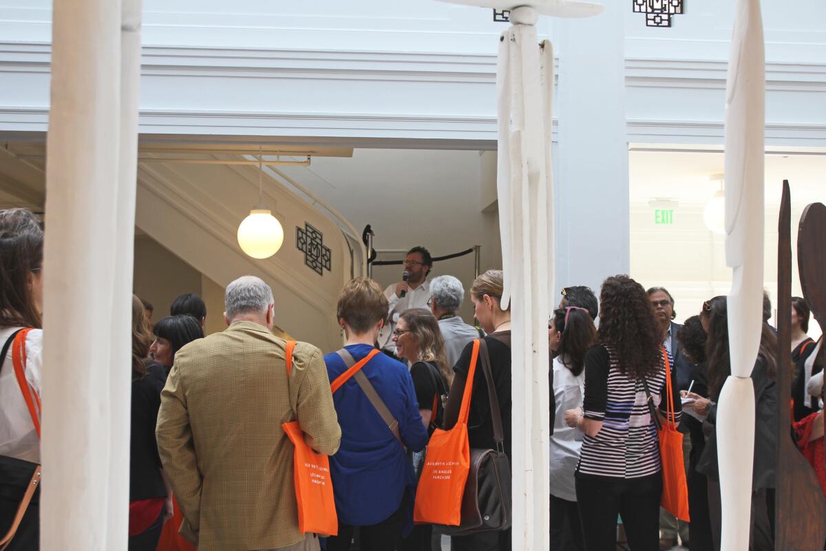 The morning began in the South Gallery at Hauser Wirth & Schimmel, with remarks from founder Iwan Wirth, who noted the presence of a number of California artists on the gallery's roster. The orange tote bags kept members of the press readily identifiable.
