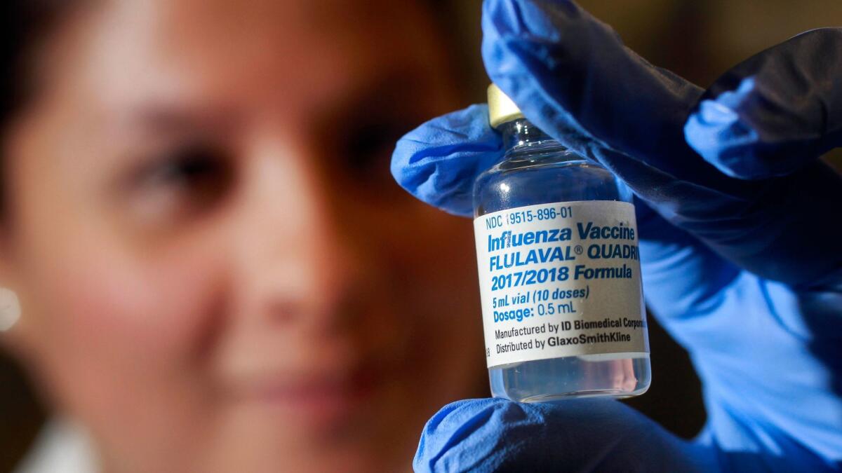Annette Rodriguez, RN, holds a vial of this season's flu vaccine at the County South Region Public Health Center in Chula Vista on Tuesday.