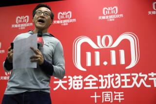 FILE - Joseph Tsai, executive vice chairman of Alibaba Group, speaks to journalists during Alibaba's 11.11 Global Shopping Festival, also known as Singles Day, in Shanghai, China, on Nov. 11, 2018. China’s Alibaba Group has announced a major management reshuffle aimed at spurring the e-commerce giant's growth at a time when the Chinese economy is slowing despite an end to COVID-19 pandemic restrictions a half-year ago. (AP Photo/Ng Han Guan, File)