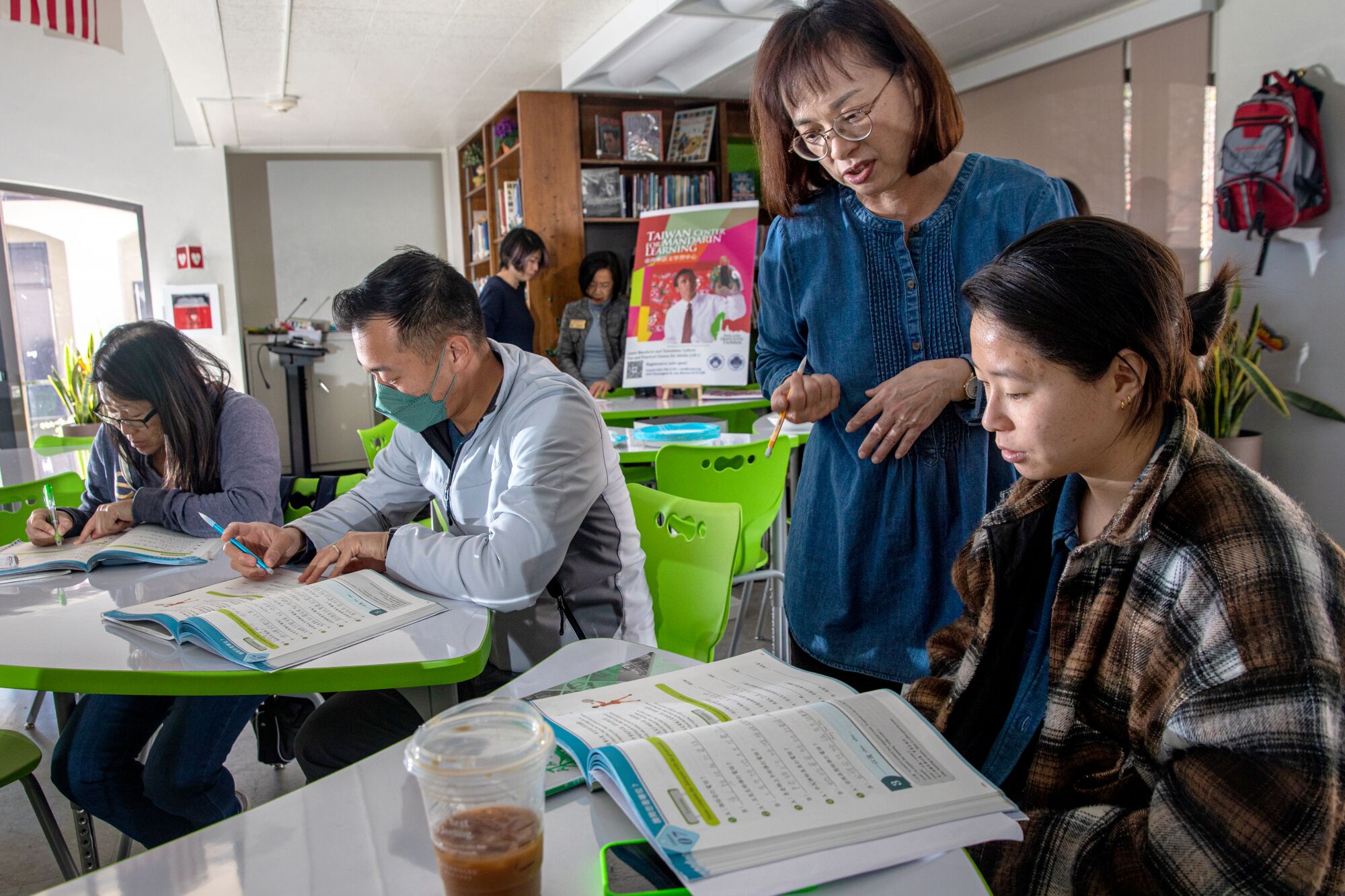 Kelly Chuang, teaches Mandarin to Crystal Huang at Chinese School 