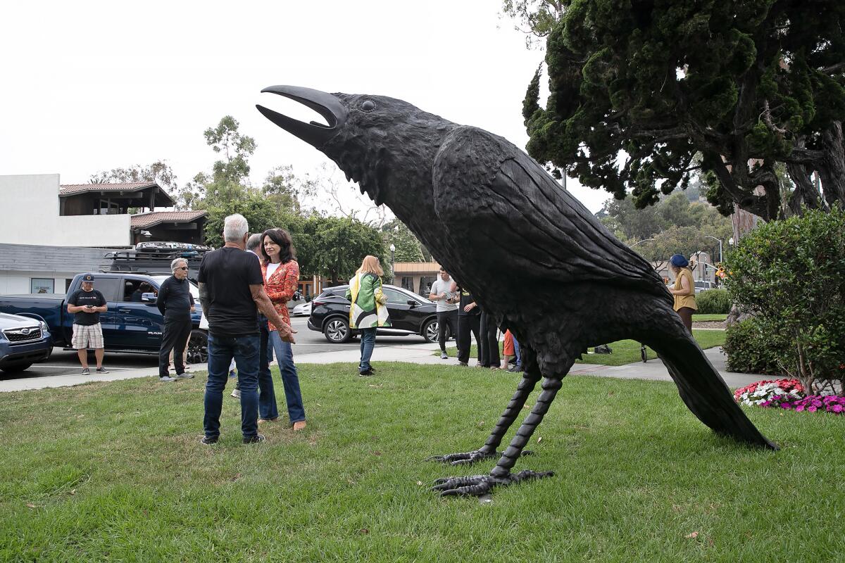 The temporary public art installation, "An Attempted Murder," at Laguna Beach City Hall. A group of crows is called a murder.