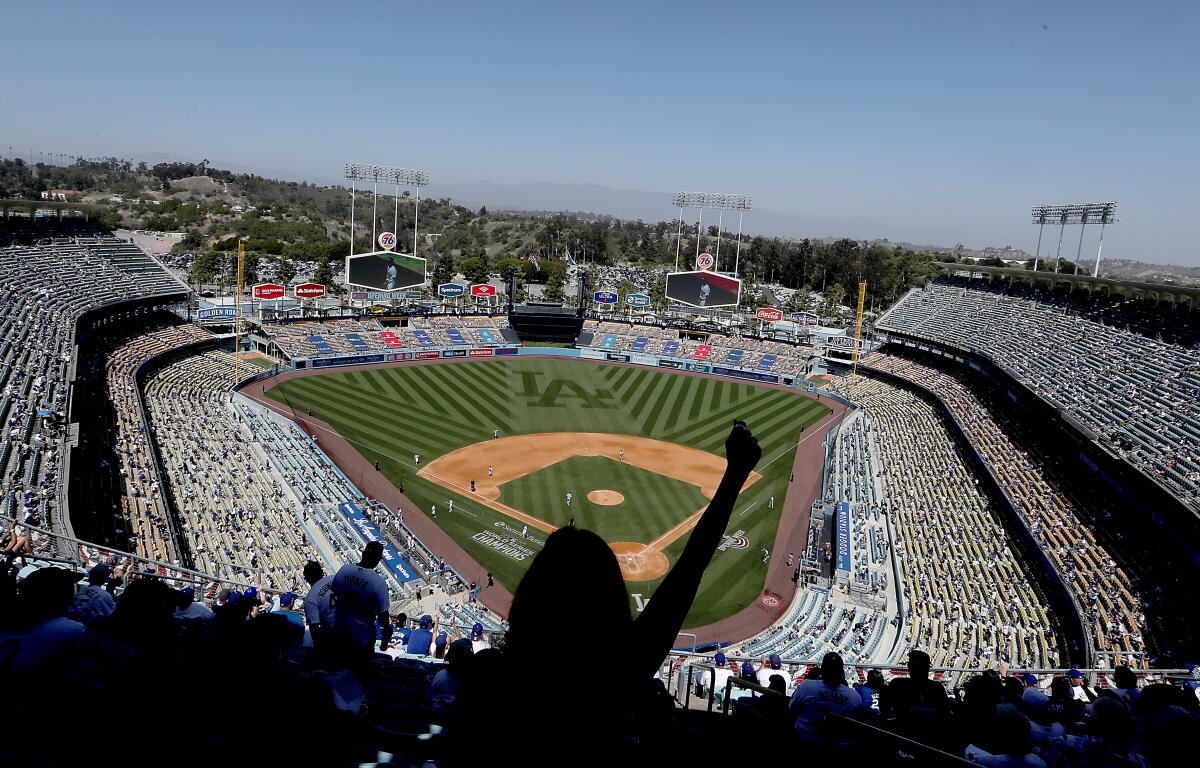 A view from the top deck of Dodger Stadium shows a sparse crowd
