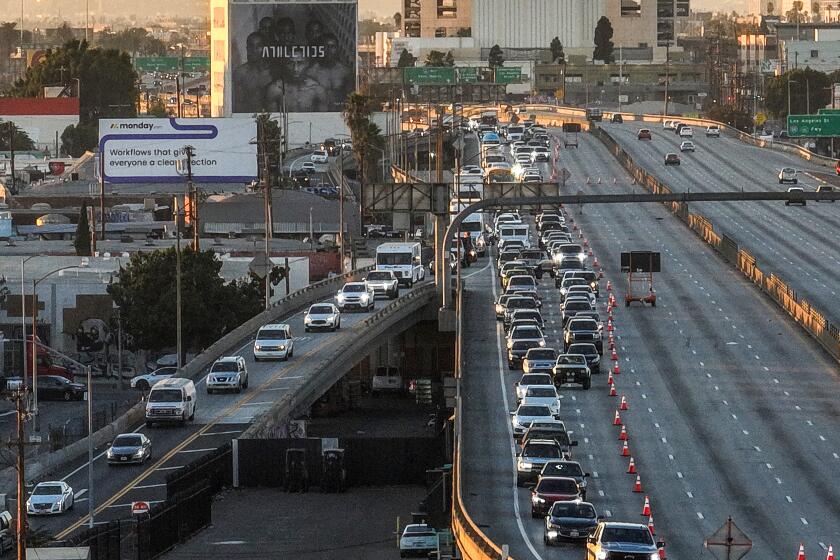 Los Angeles, CA, Monday, November 13, 2023 - Traffic is diverted from the 10 Freeway just West of the site of a large pallet fire that burned below, shutting the damaged area of the freeway. (Robert Gauthier/Los Angeles Times)