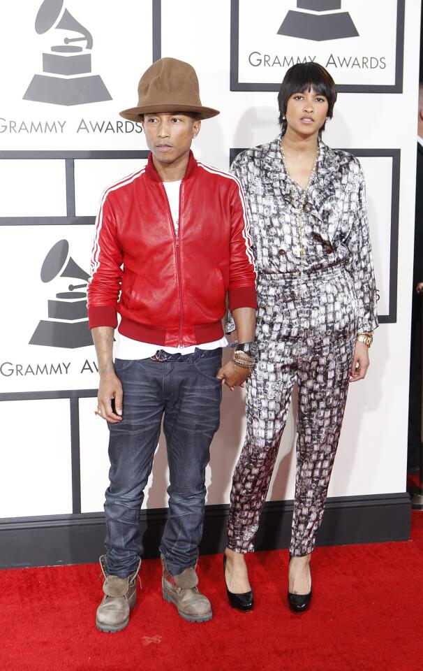 Pharrell Williams and date on the red carpet.