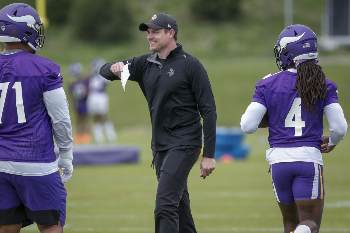 FILE - Minnesota Vikings coach Kevin O'Connell directs players during drills at the NFL football team's practice facility in Eagan, Minn., May 17, 2022. O’Connell takes the Vikings into his first training camp, after being hired in February to replace Mike Zimmer. (AP Photo/Bruce Kluckhohn, File)