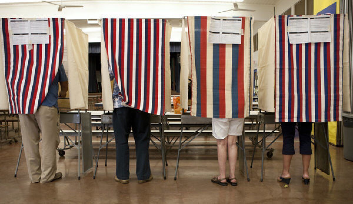 Voters cast their ballots at Waikiki Elementary on Election Day in Honolulu.
