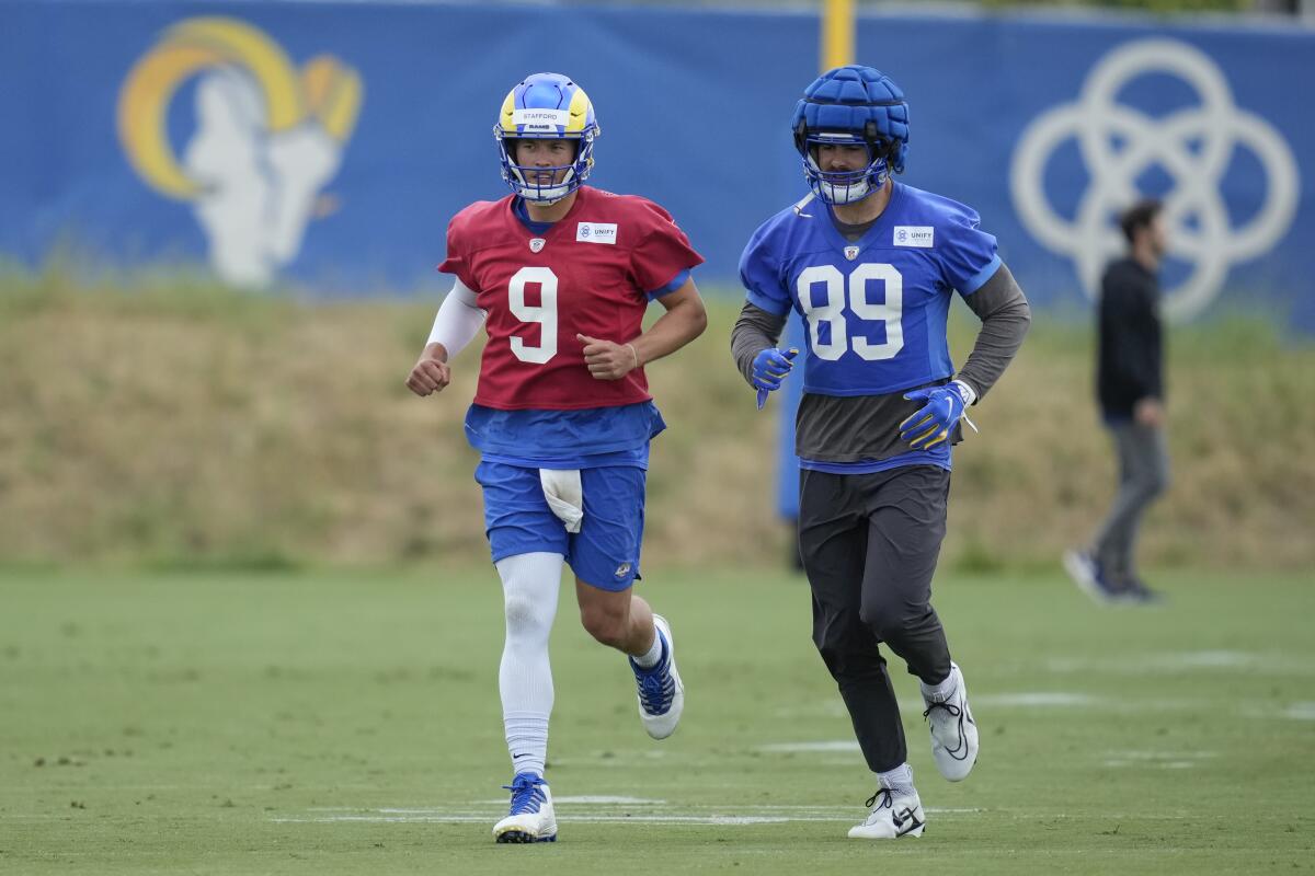 Rams quarterback Matthew Stafford (9) and tight end Tyler Higbee (89) have displayed their connection at camp.