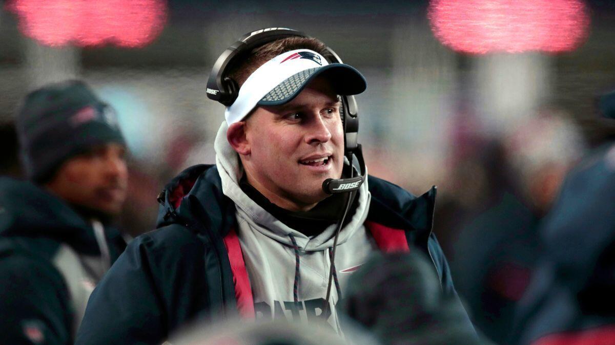 New England Patriots offensive coordinator Josh McDaniels watches from the sideline during the second half of an NFL divisional playoff football game against the Tennessee Titans on Saturday.