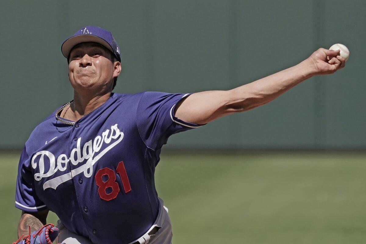 Dodgers relief pitcher Victor González throws during a spring training game against the Texas Rangers in March.