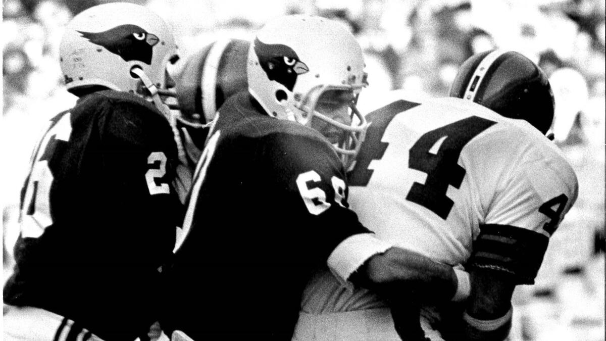 St. Louis Cardinals linebacker Dave Meggysey makes a tackle.