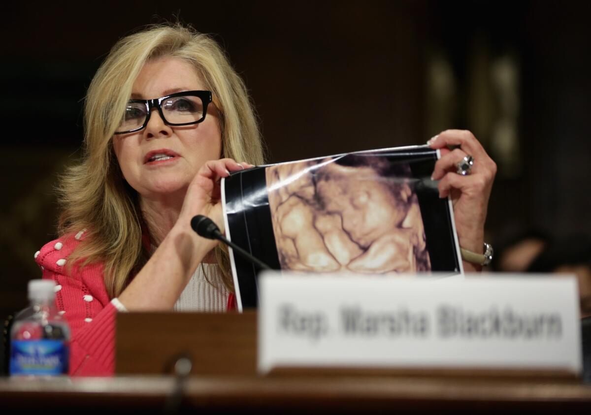 But does she care at all about the mothers? Rep. Marsha Blackburn (R-Tenn.) holds up a sonogram of her unborn grandson in testifying against a Senate bill to override state abortion restrictions.