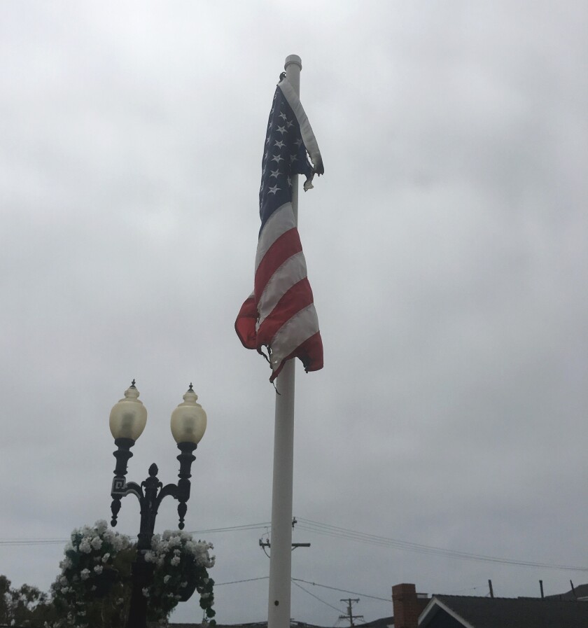 A burned American flag hanging at the Balboa Island bridge in Newport Beach.