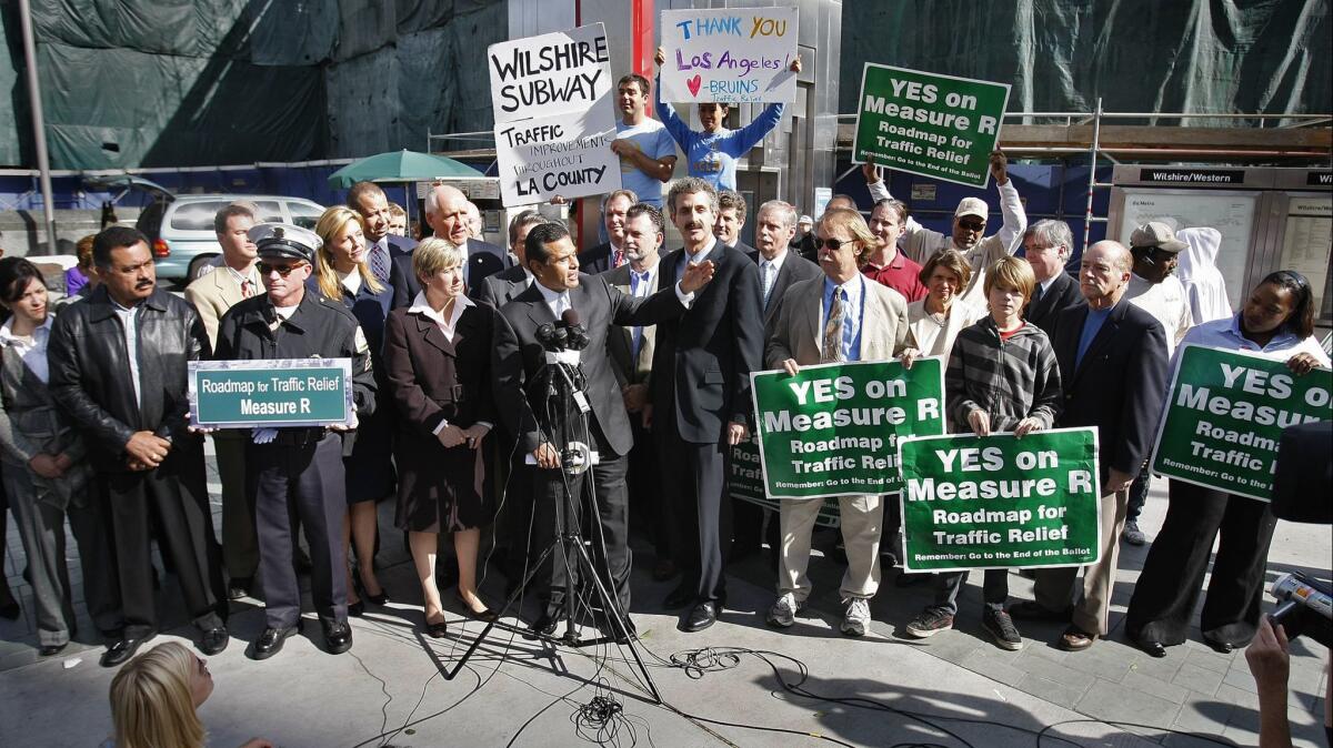 Mayor Antonio Villaraigosa and Metropolitan Transportation Authority officials speak at a news conference on Nov. 4, 2008, to celebrate the surprising victory of the transit tax known as Measure R to pay for rail construction projects.