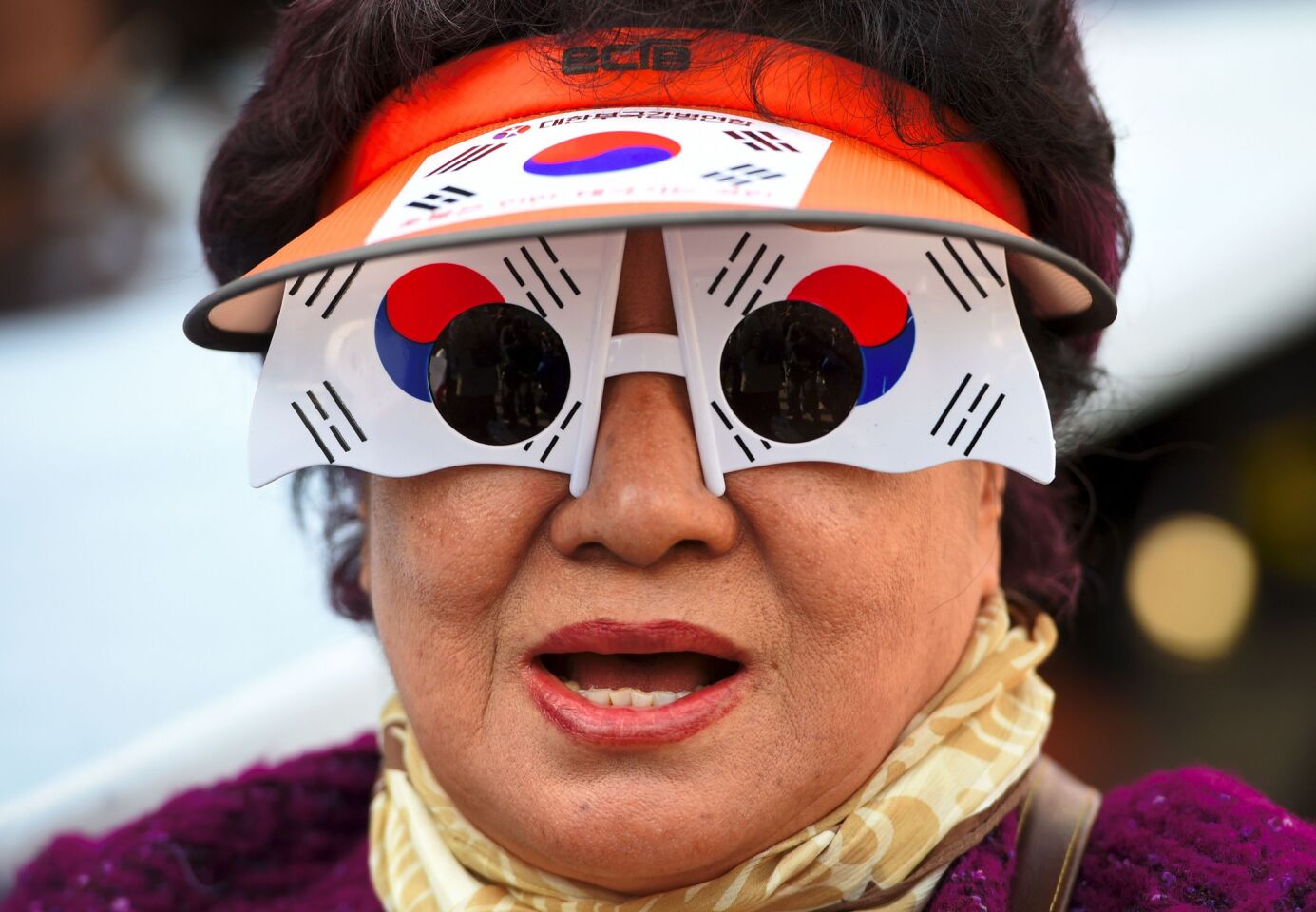 A supporter of South Korea's impeached President Park Geun-Hye wears national-flag glasses at a rally Saturday in Seoul.