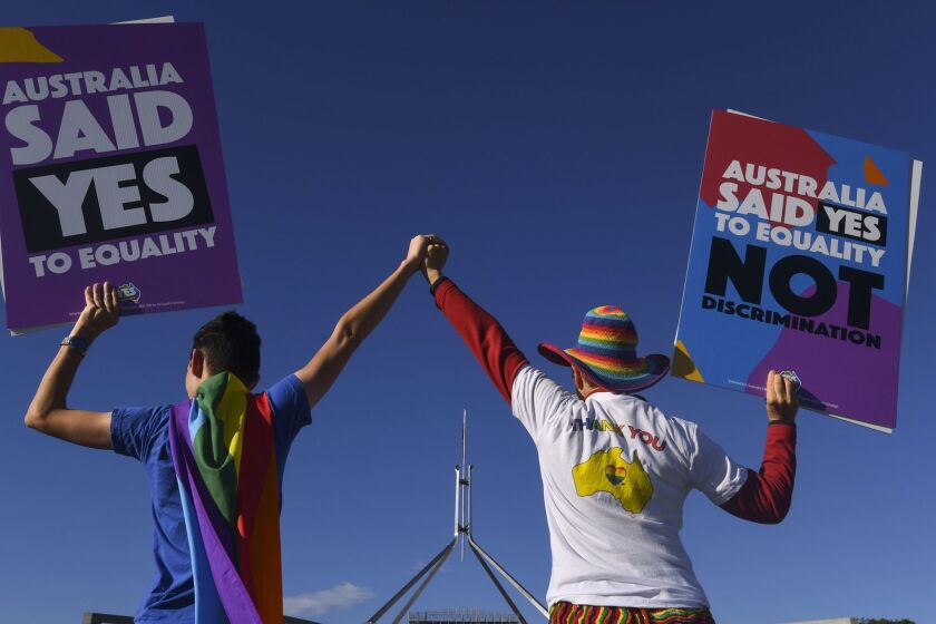 AUSTRALIA AND NEW ZEALAND OUT Mandatory Credit: Photo by LUKAS COCH/EPA-EFE/REX/Shutterstock (9263385o) Same-sex marriage campaigners pose for pictures during an equality rally outside Parliament House in Canberra, Australian Capital Territory, Australia, 07 December 2017. A bill allowing same-sex couples to marry could see its historic pass on the day as the Australian parliament is on its final sitting. Same-sex marriage campaigner in equality rally outside Parliament House in Canberra, Australia - 07 Dec 2017 ** Usable by LA, CT and MoD ONLY **