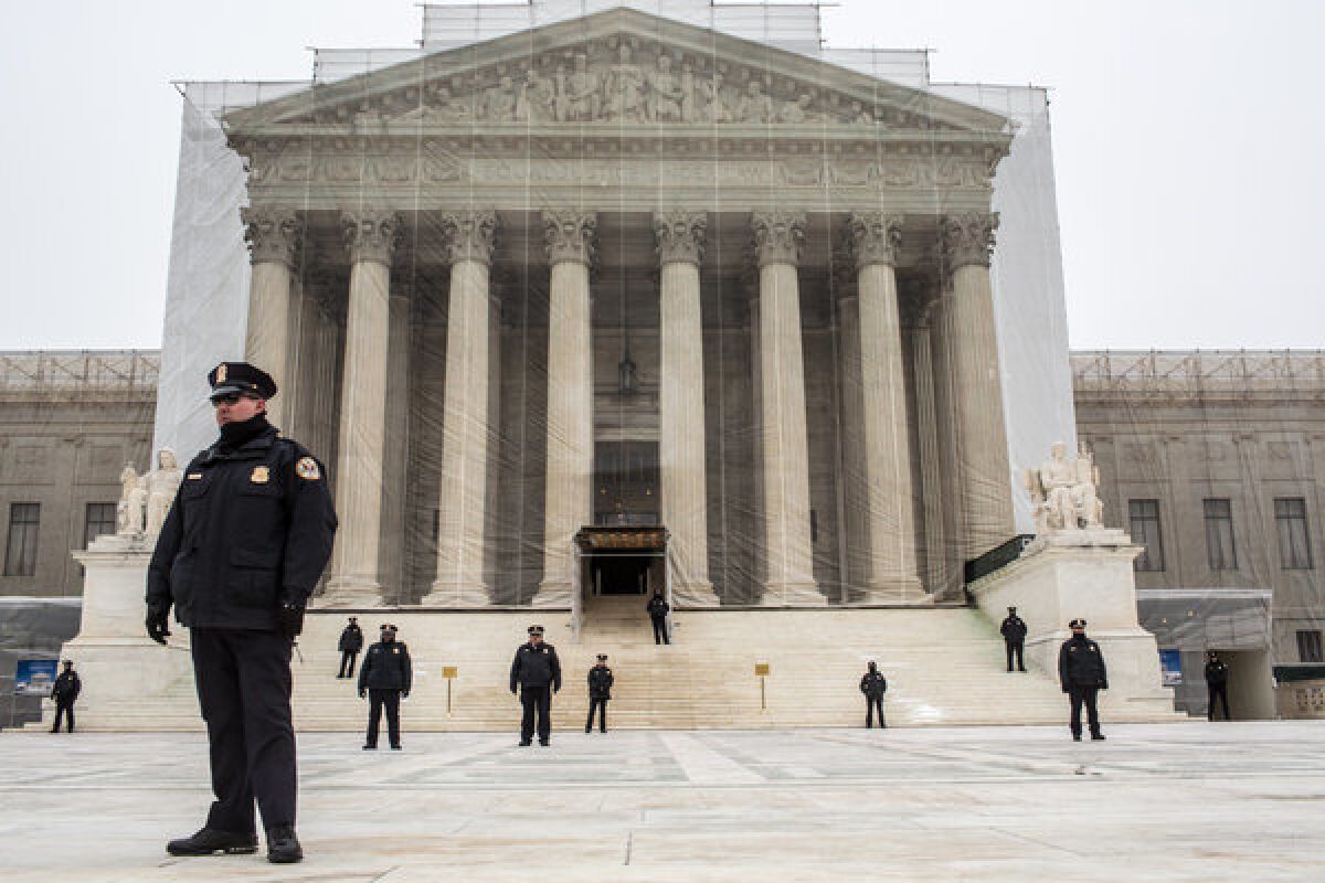 Police officers guard the plaza in front of the Supreme Court as anti-abortion protesters hold the March for Life in Washington.