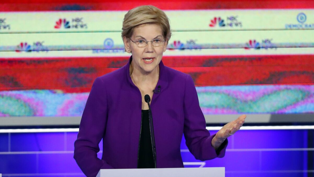 Democratic presidential candidate Sen. Elizabeth Warren (D-Mass.) stood at center stage, but pulled her party to the left during Wednesday night's Democratic debate.