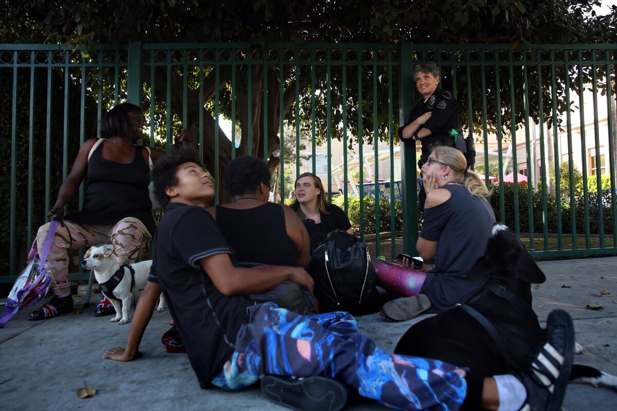 Los Angeles Police Sgt. Shannon Geaney checks in on a group of homeless people 