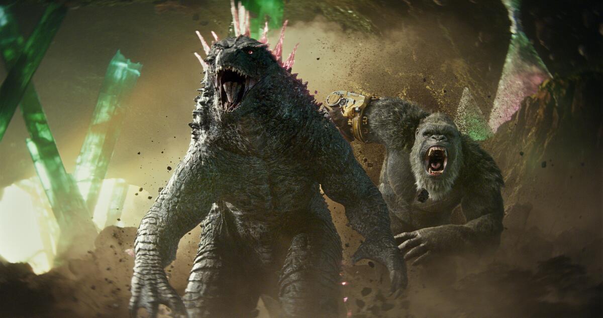 Godzilla and Kong rush into battle in a cave.