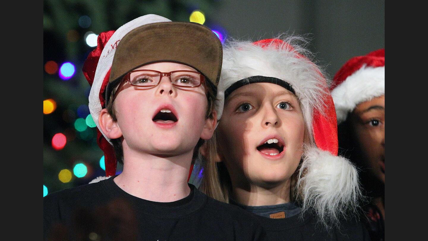 Verdugo Woodlands Elementary School fifth graders Will Hays, 10, Miles Clements, 10, sing at the City of Glendale tree lighting at City Hall on Thursday, December 1, 2016. The event was put together by Glendale Parks and Recreation with entertainment by Verdugo Woodlands Elementary School and Wilson Middle School, and Santa Claus made an appearance.