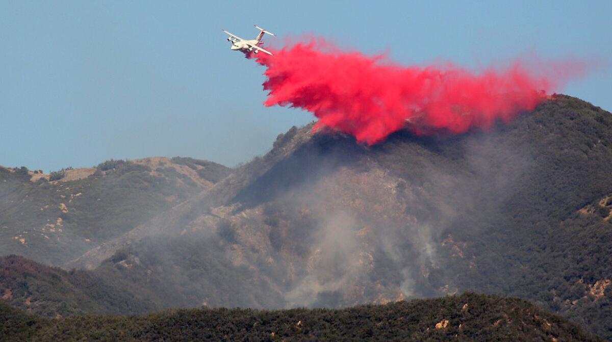 Tankers drops retardant during an aerial assault on a brush fire that has broken out in the area of Montecito Peak near Santa Barbara Thursday morning.
